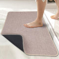 Beige textured bathroom floor mat