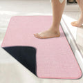 Pink textured bathroom floor mat
